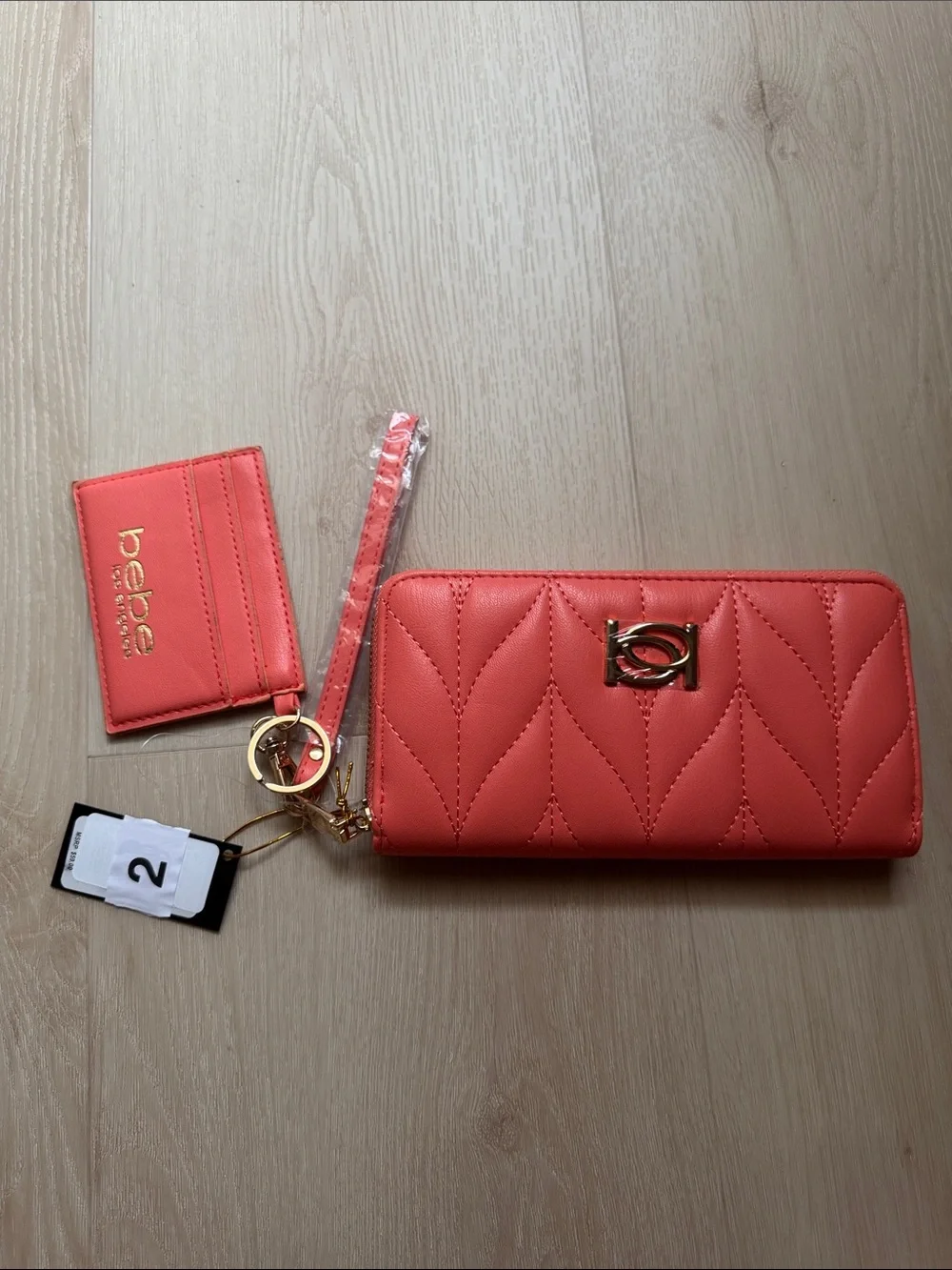 bebe Coral Quilted Wristlet Clutch with Gold Logo